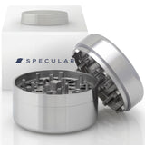 OG1 304 stainless steel grinder, closed, beside its gift box