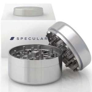 OG1 304 stainless steel grinder, closed, beside its gift box